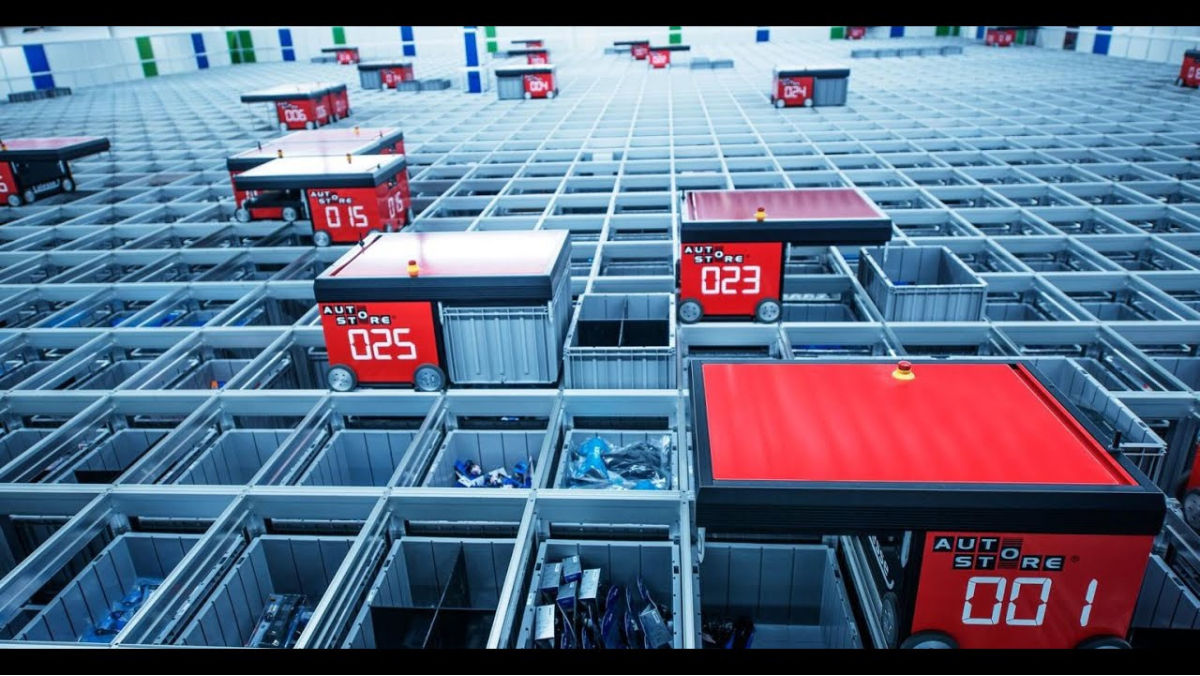 Robotic grid system moving storage bins in an automated vertical farming facility.
